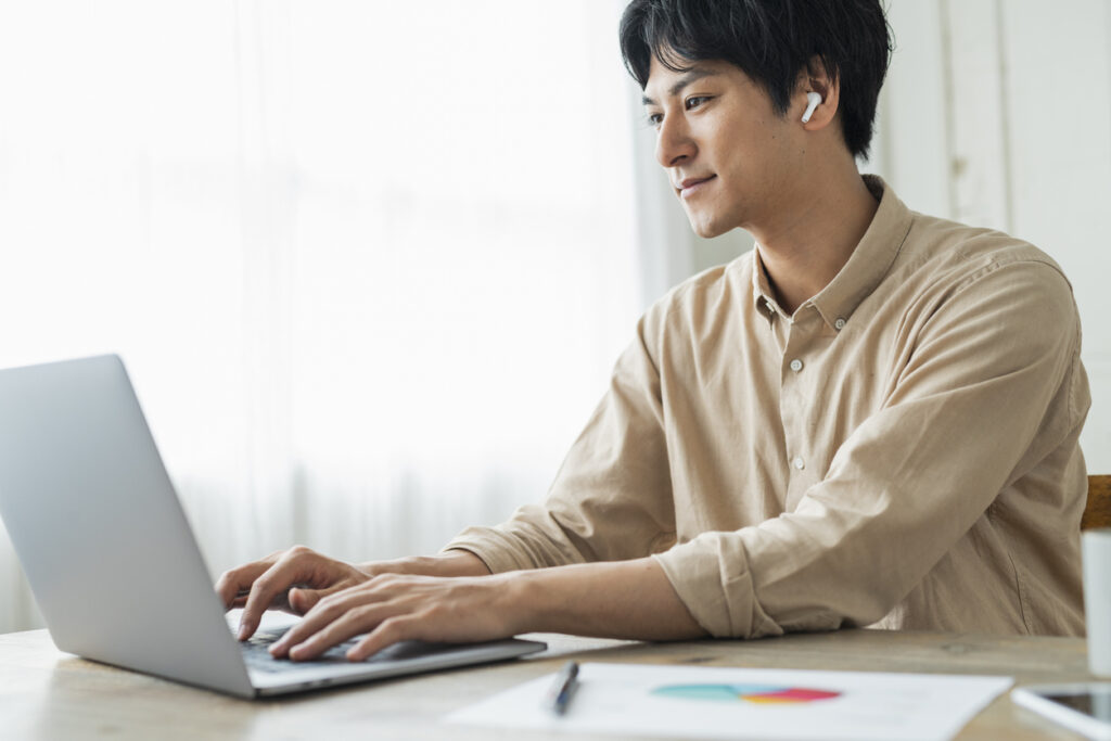 One man working remotely using a laptop