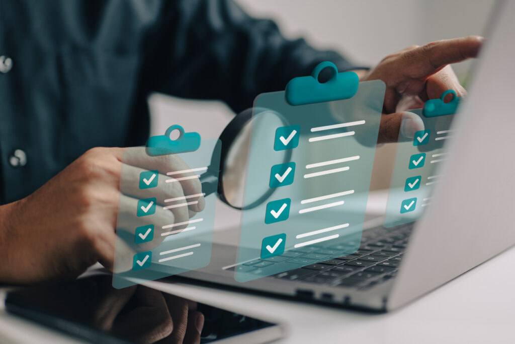 Businessman using magnifying glass to depict a background check