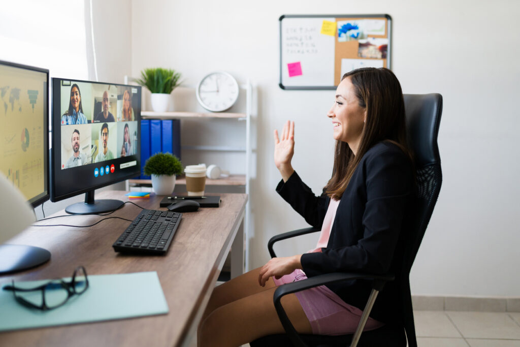 woman talking with coworkers with work-from-home jobs