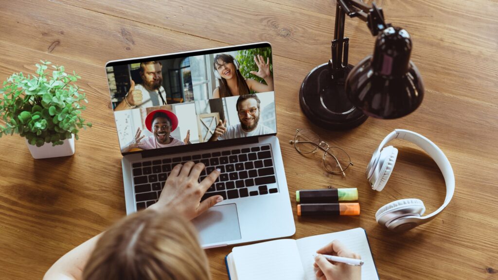 woman talking to her diverse and inclusive remote team through a communication platform