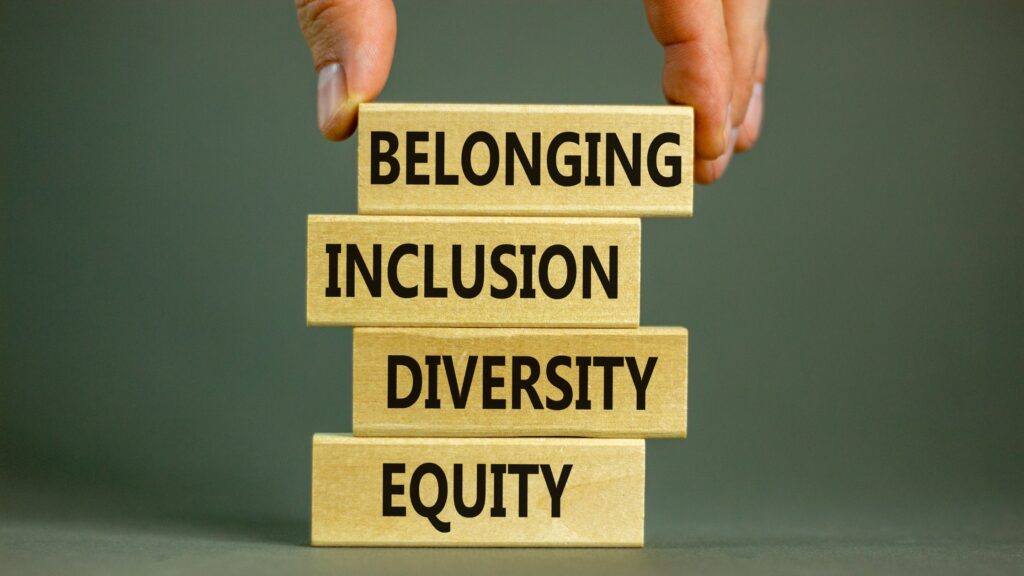 blocks stacked with words as follows: belonging, inclusion, diversity, equity